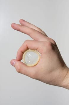 hand holding condom