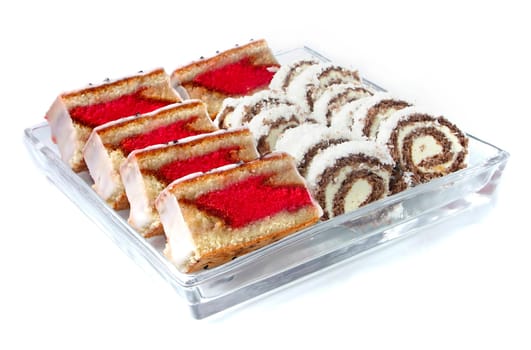 Rum-tea and coconut sweets on glass plat