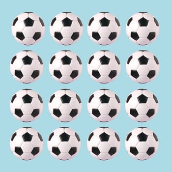 Soccer balls in front of blue