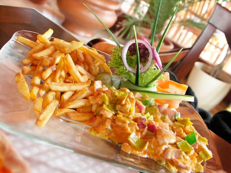 Chicken mixture and chips and vegetable