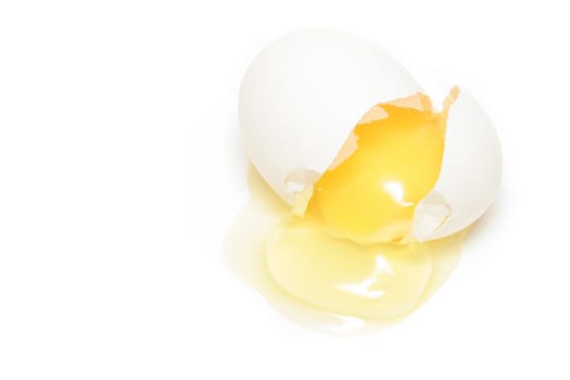 cracked egg over white