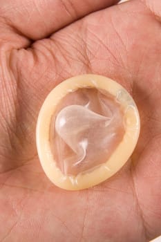 hand holding condom
