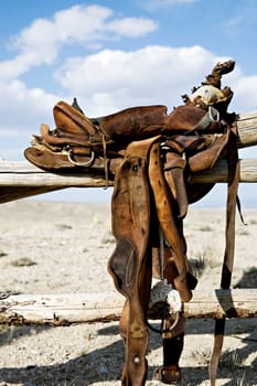 saddle on rural fence