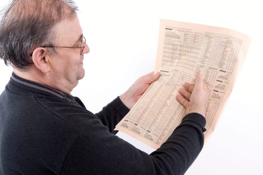Senior reads newspaper