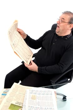 Senior reads newspaper