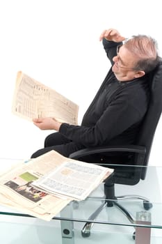 Senior reads newspaper