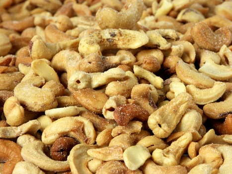 Pile of roasted cashew nuts - background