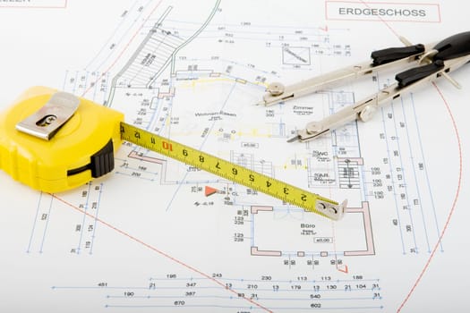 Blueprint with compass and roller meter