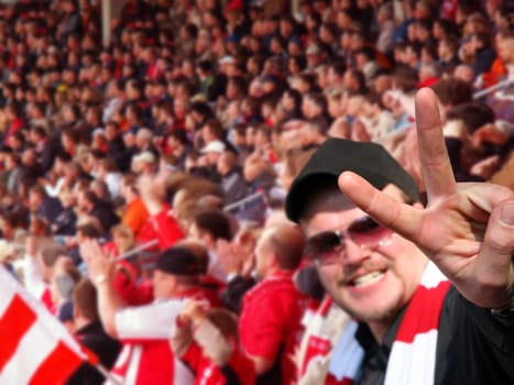 Victory sign,football fan sure of victory