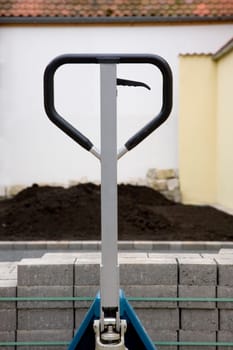 Pallet truck with paving stones