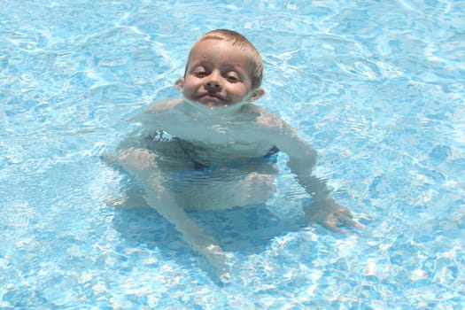 Boy sitting in the water