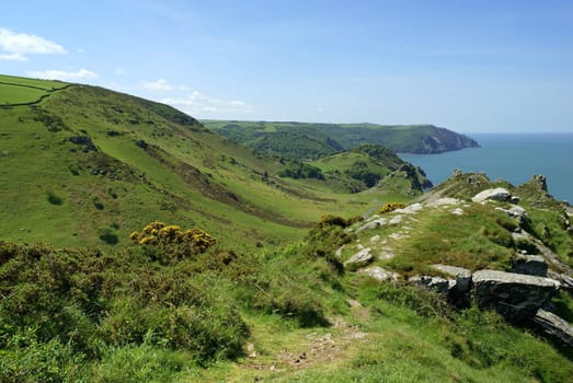 View from the South West Coast footpath on the north coast of Devon into the Valley of Rocks. UK