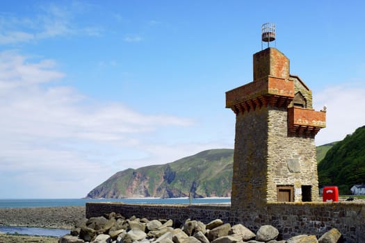 The historic Lynmouth Lighthouse set against the backdrop of the cliffs at Foreland Point. Devon,UK