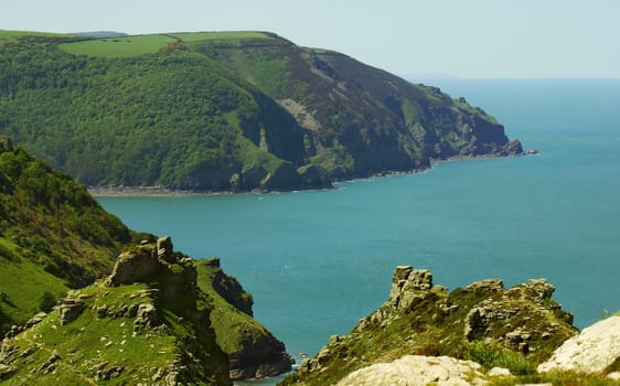 View from the South West Coast Walk across Woody Bay on the North Coast of Devon to the 200m high cliffs at Highvee Point. UK
