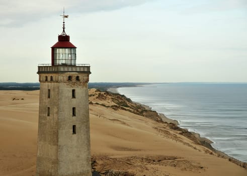 This lighthouse is located in a shifting dune in Denmark.