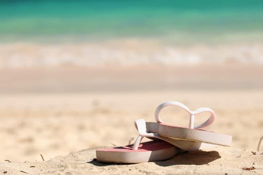 Flipflops on a sandy beach