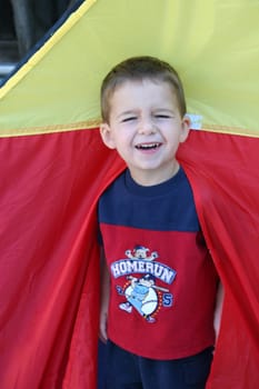 boy in toy tent