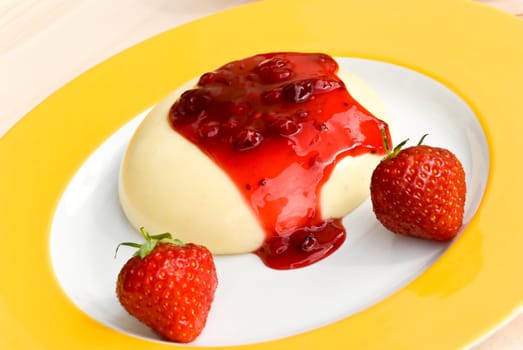 Vanilla pudding with currant sauce