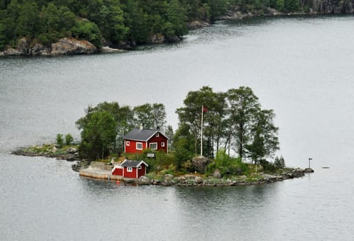 Small cottage in a fjord in Norway.
