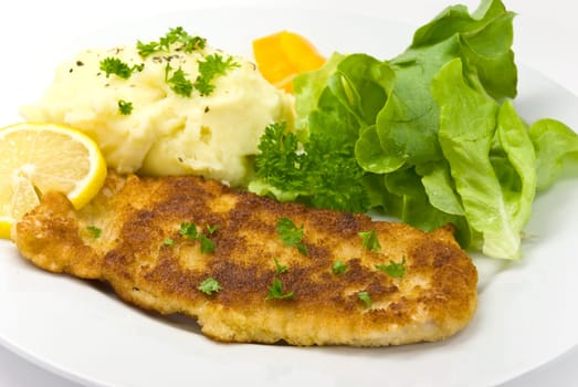 Schnitzel breaded with salad