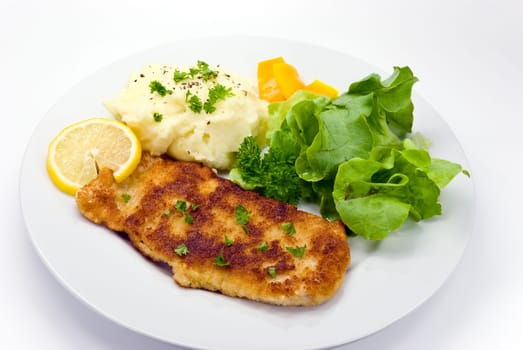 Schnitzel breaded with salad