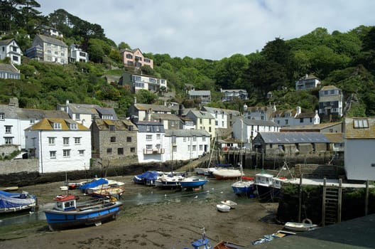 The harbour of Polperro,a small quirky fishing village on the south-west coast footpath that runs along the coast on both sides. South Cornwall,UK