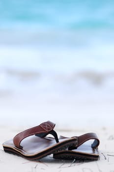 Flipflops on a sandy beach