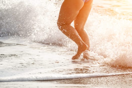 Running woman. Female runner jogging during the sunrise on beach. Woman Runner feet running on the beach at sunrise. woman fitness sunrise jog workout wellness concept.