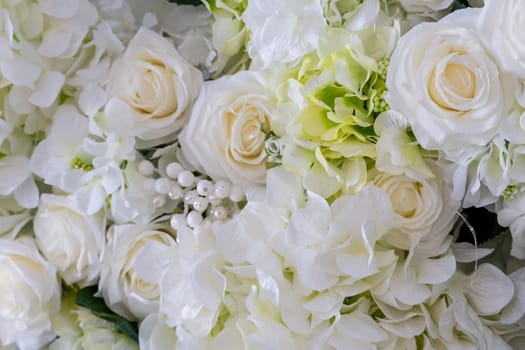 Background of white roses photographed close-up from above.