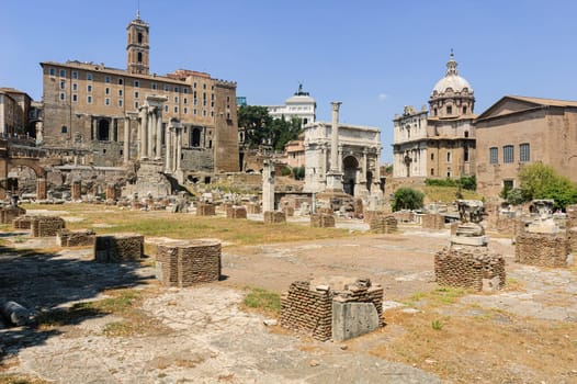 View of the Basilica Julia in the forum of Rome, with the Tabularium, the arch of Septimius Severus and the Curia in the background, among many other illustrious monuments