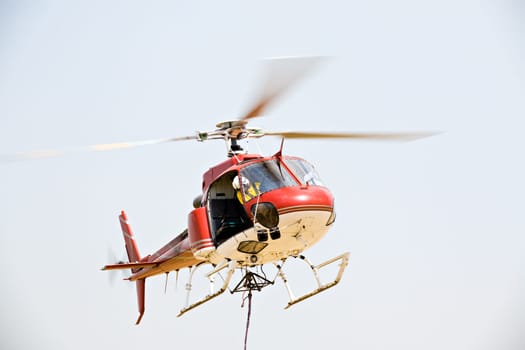 helicopter picking up cargo