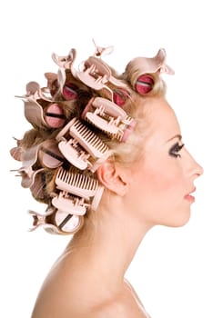 Young beautiful girl is having hair curl