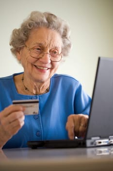 Elderly woman shopping online