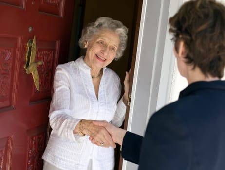 Senior woman friendly handshake