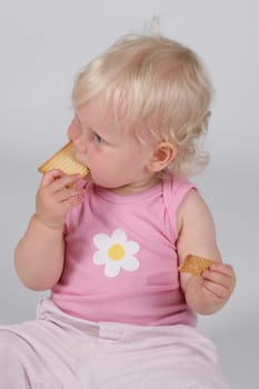 Toddler with biscuit