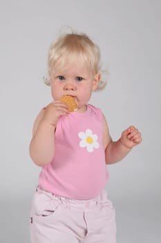 Toddler with biscuit in hand