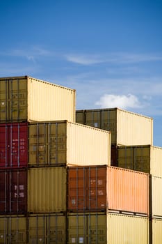 shipping containers against blue sky