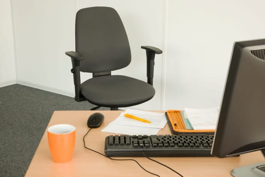 Swivel chair and desk in the office