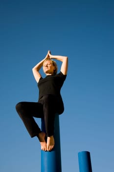 Woman doing yoga - eyes closed