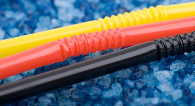 Drinking straws on a blue background