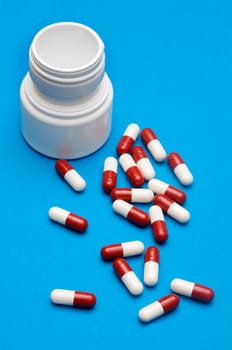 Pills over blue background