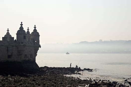 Man fishing near Belem Tower