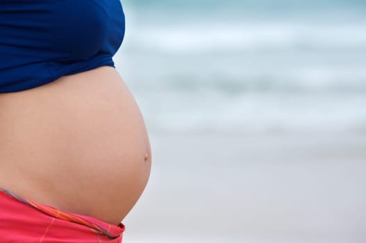 Pregnant with sea background