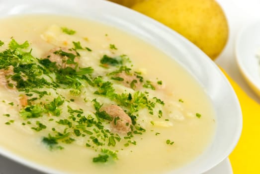 Potato cream soup with meatballs