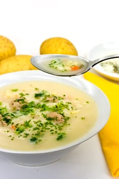 Potato cream soup with meatballs
