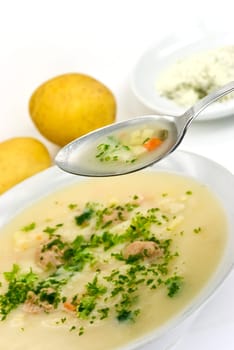 Potato cream soup with meatballs