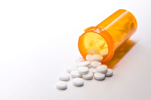 aspirin medicine with bottle on white