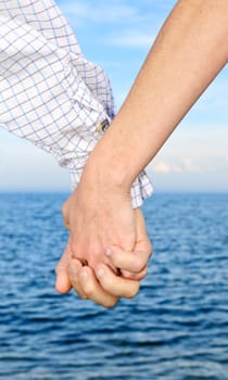Couple holding hands