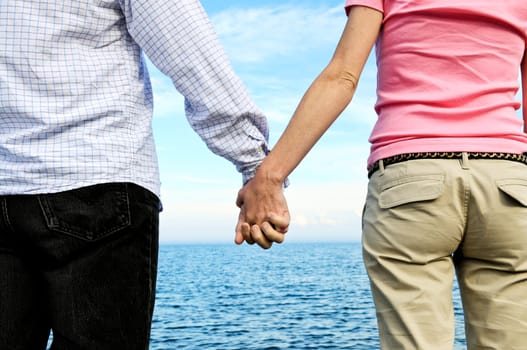 Couple holding hands