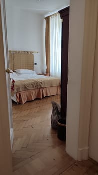 Bedroom wooden floor door indoor house hotel room interior design apartment windows bed white wall modern building architecture design . High quality photo